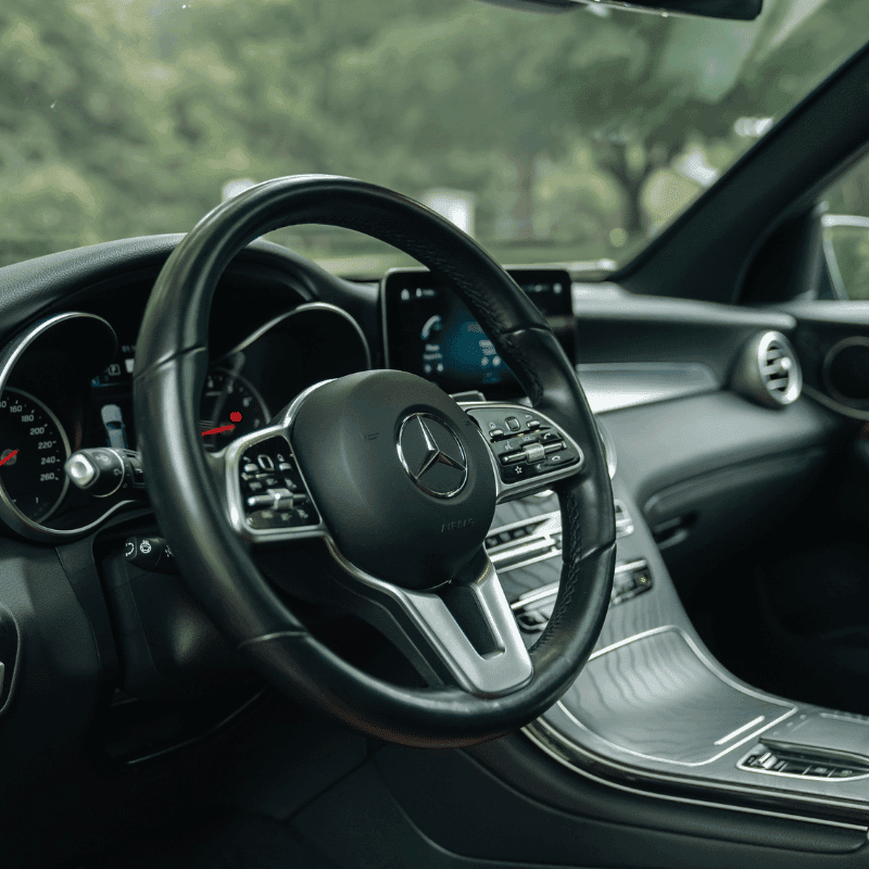 Luxury vehicle interior with dashboard and steering wheel